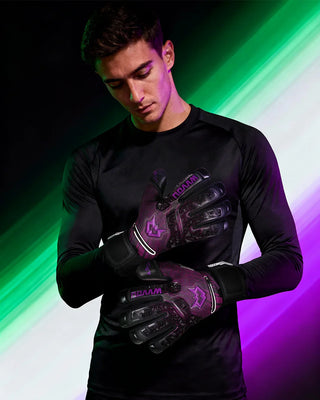 Pro goalkeeper gloves with bold purple design, extreme grip, and finger protection for soccer goalies